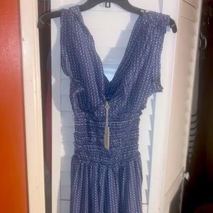Woman XS Max studio jumpsuit with tags never been worn